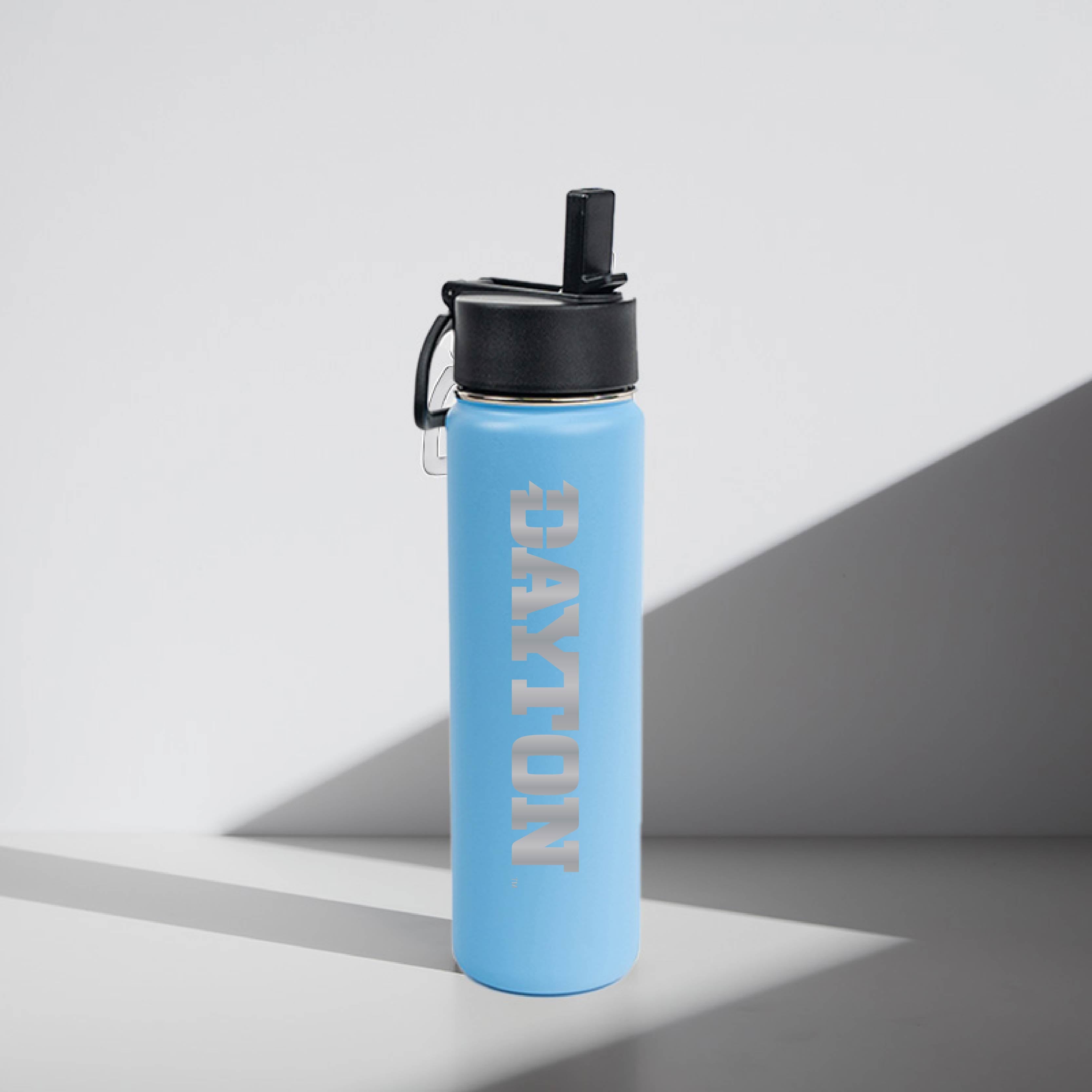 "Dayton" Light blue water bottle with black lid on a gray background
