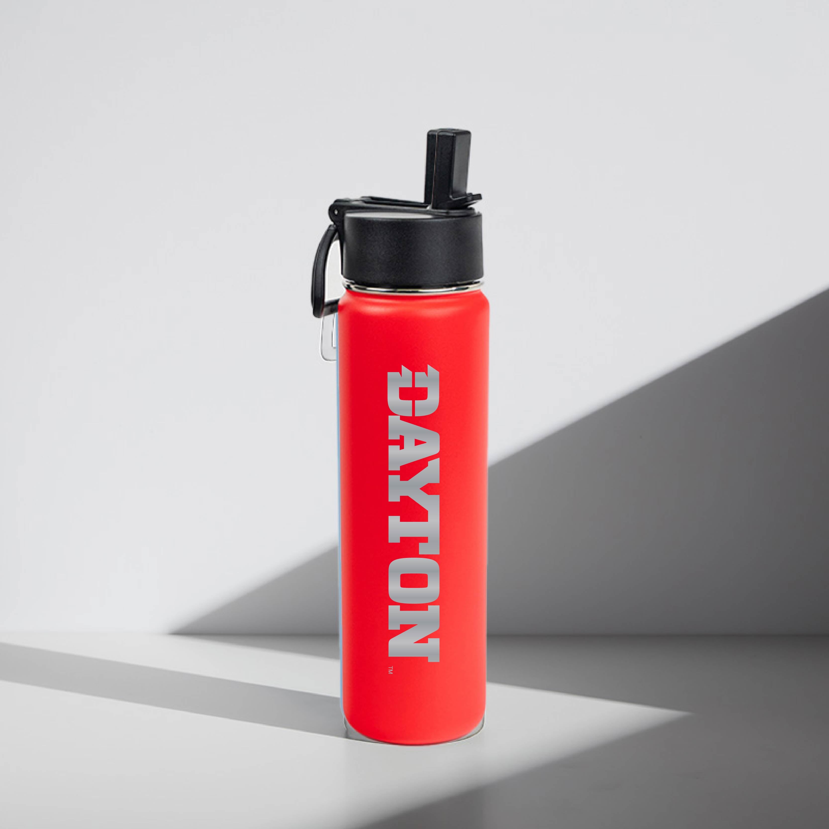 Red water bottle with 'Dayton' branding on a gray background