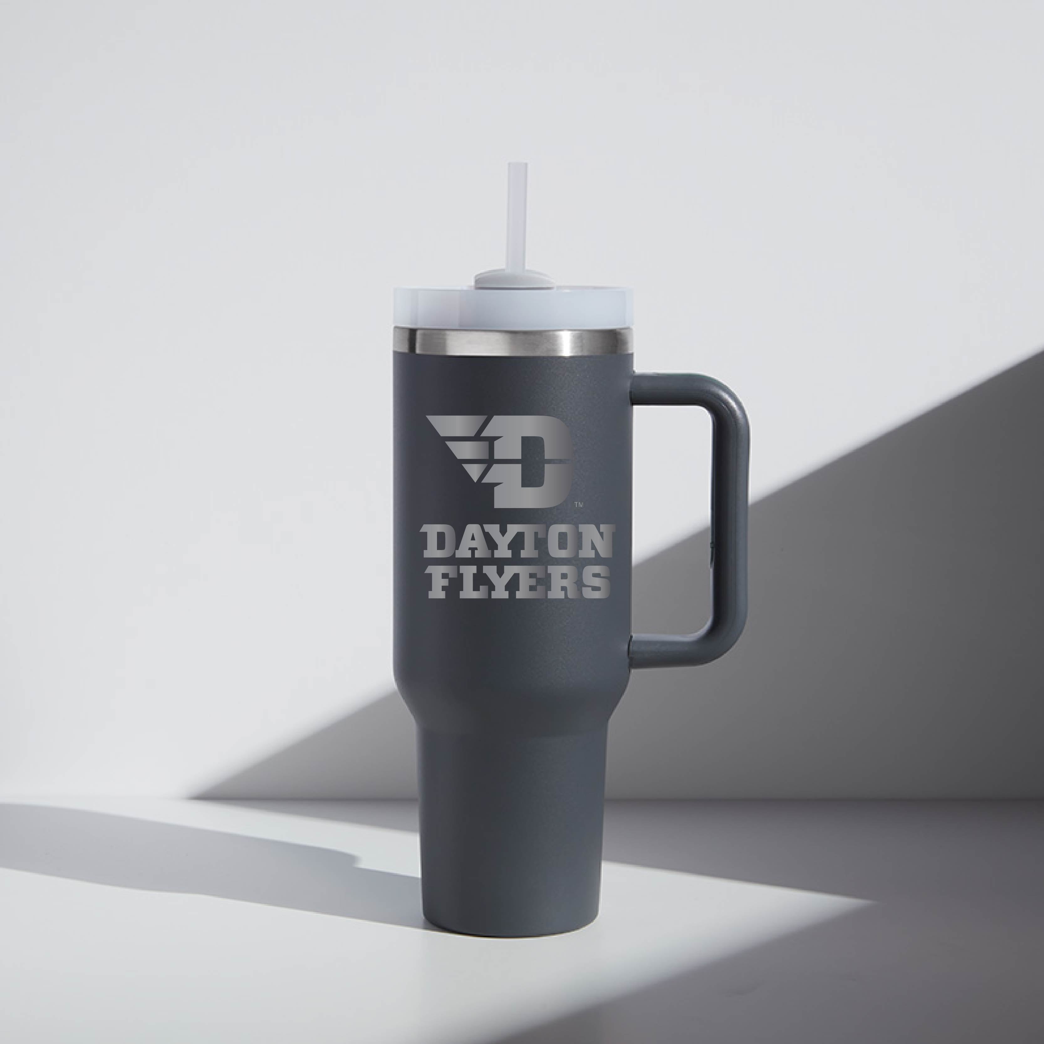 Gray travel mug with 'Dayton Flyers' text and logo on a light gray background