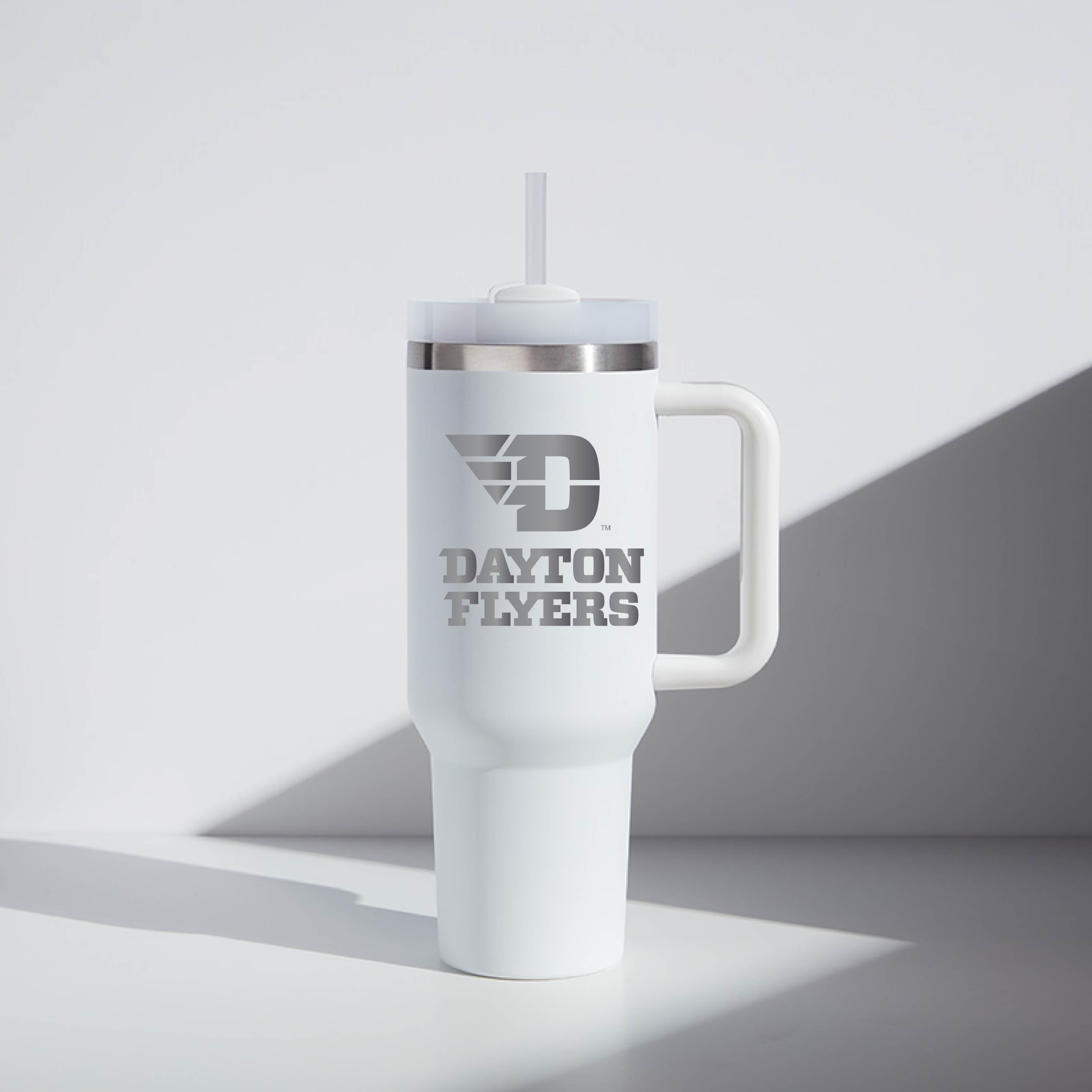 White tumbler with 'Dayton Flyers' text on a light gray background
