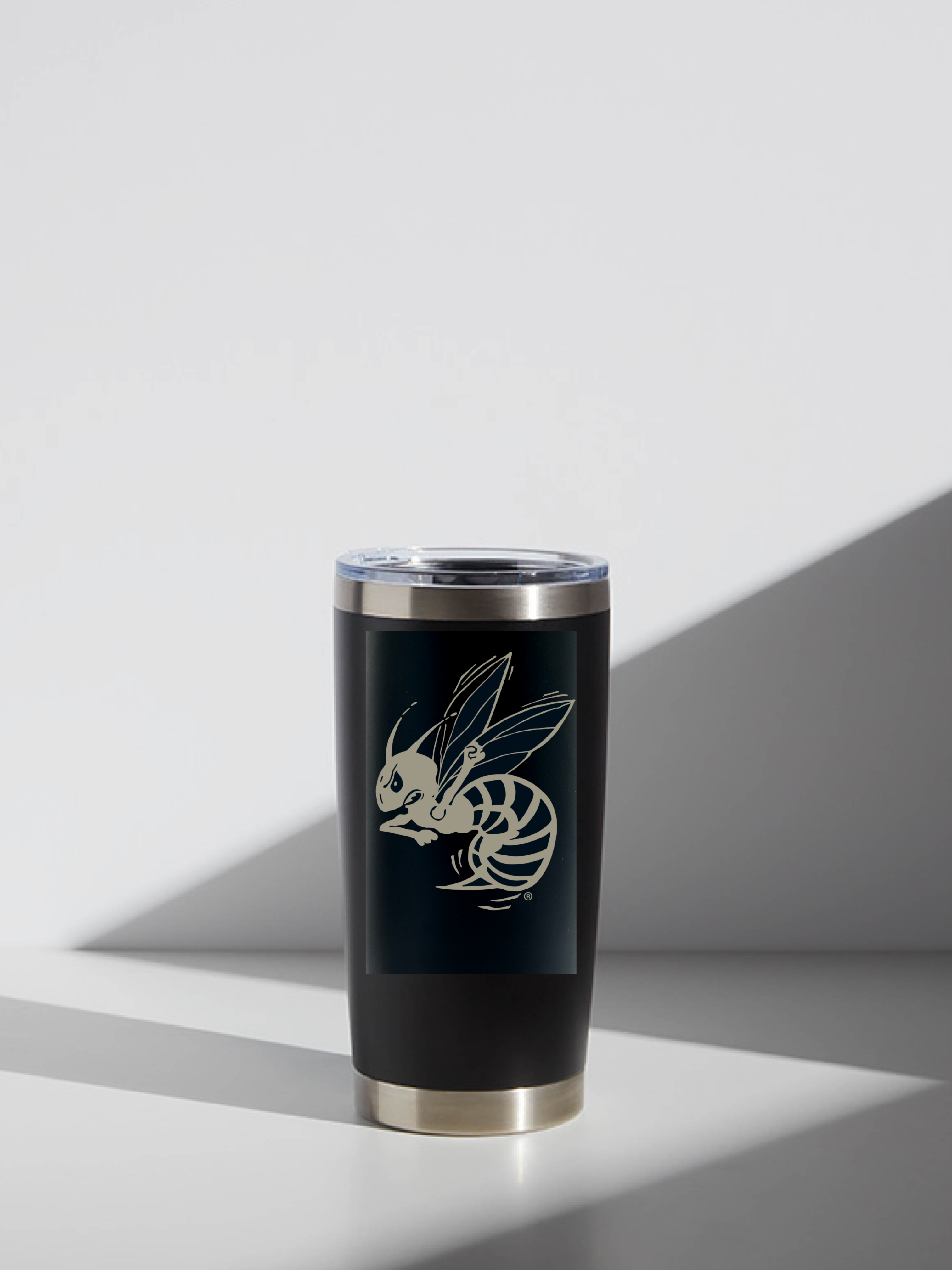 Black tumbler with a Medina Highland Hornet design on a light gray background