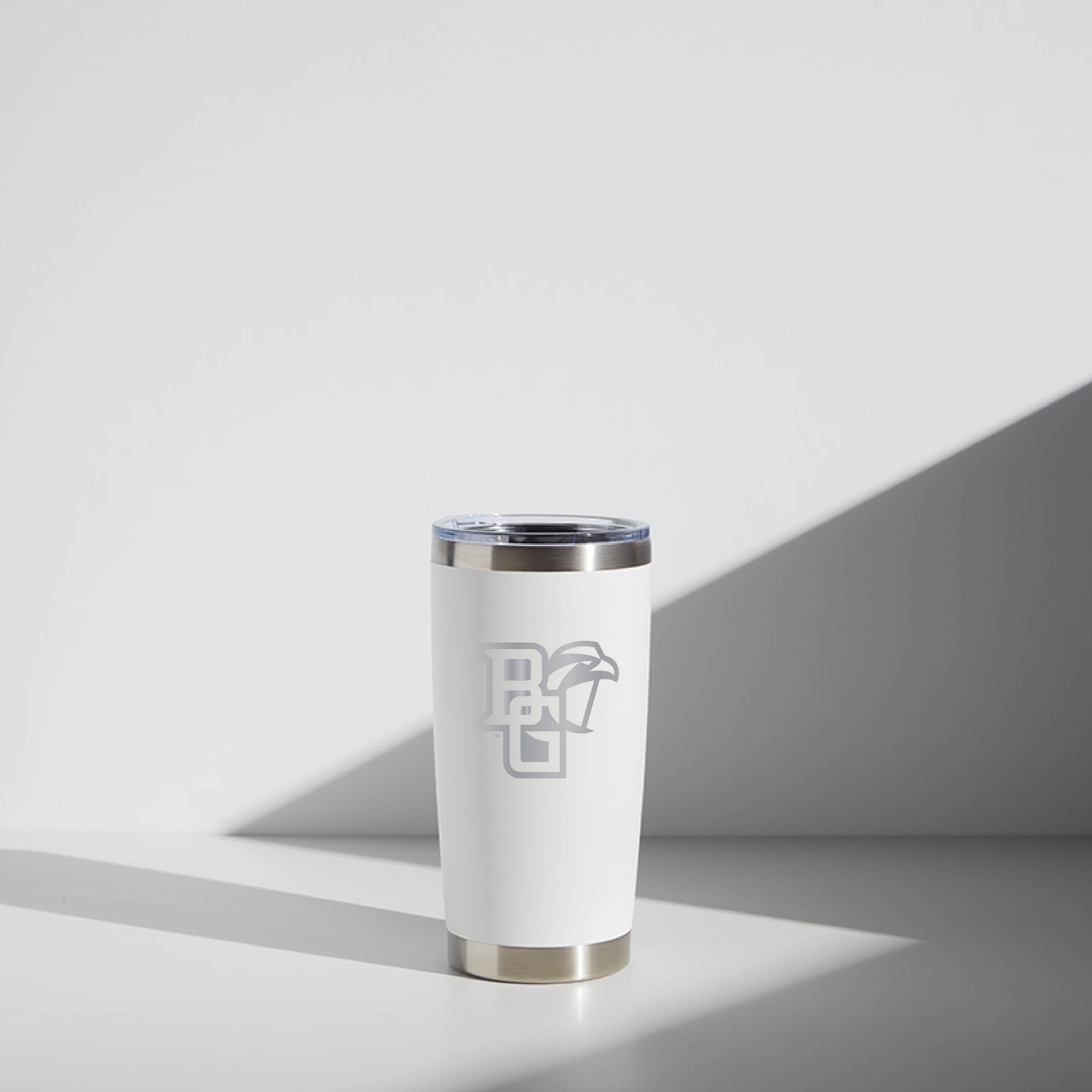 20 oz WATR insulated tumbler in white with a Bowling Green Falcon logo, featuring a stainless steel rim and base, displayed in soft lighting.