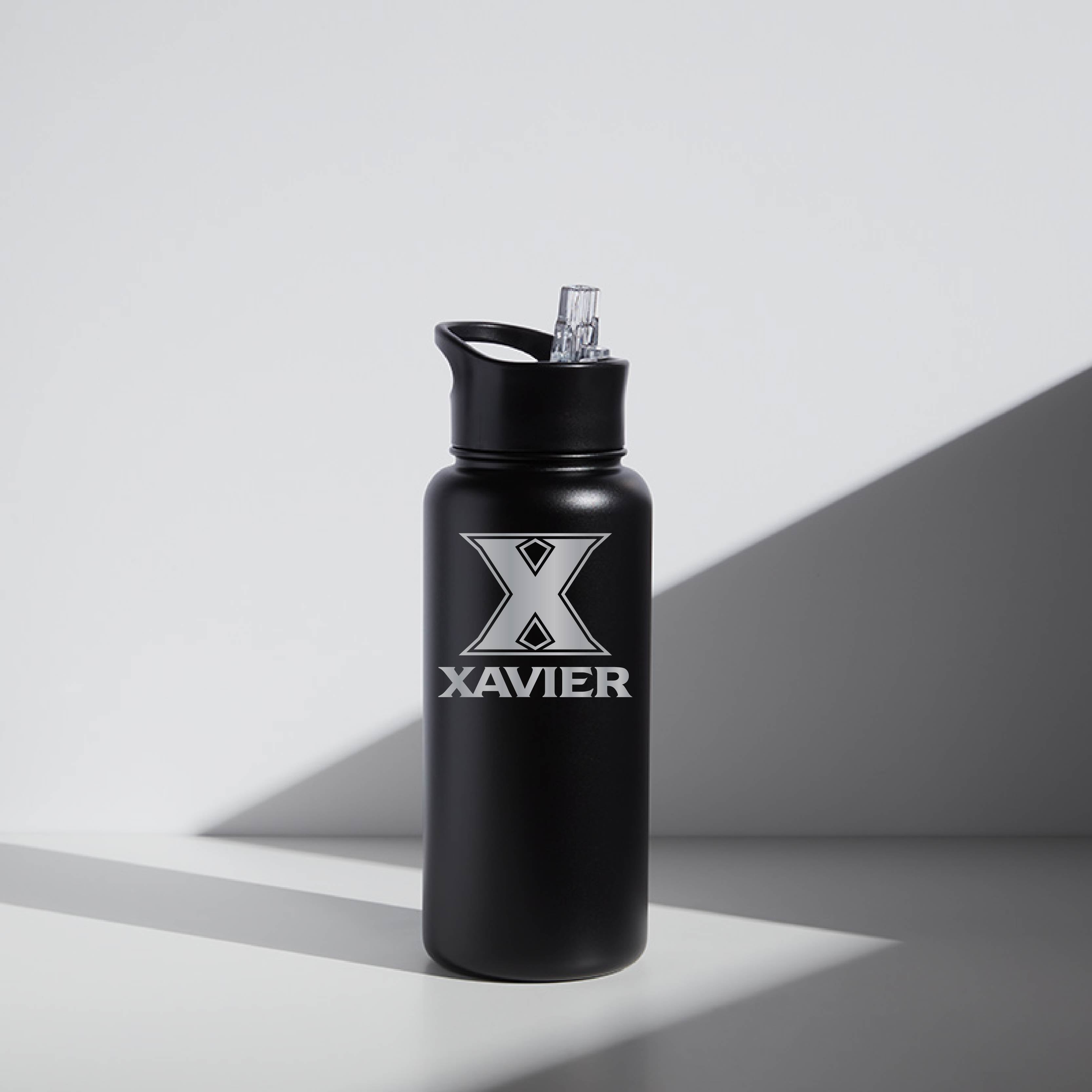 A black 32oz dual vacuum insulated stainless steel tumbler with built-in straw and Xavier University "X" logo